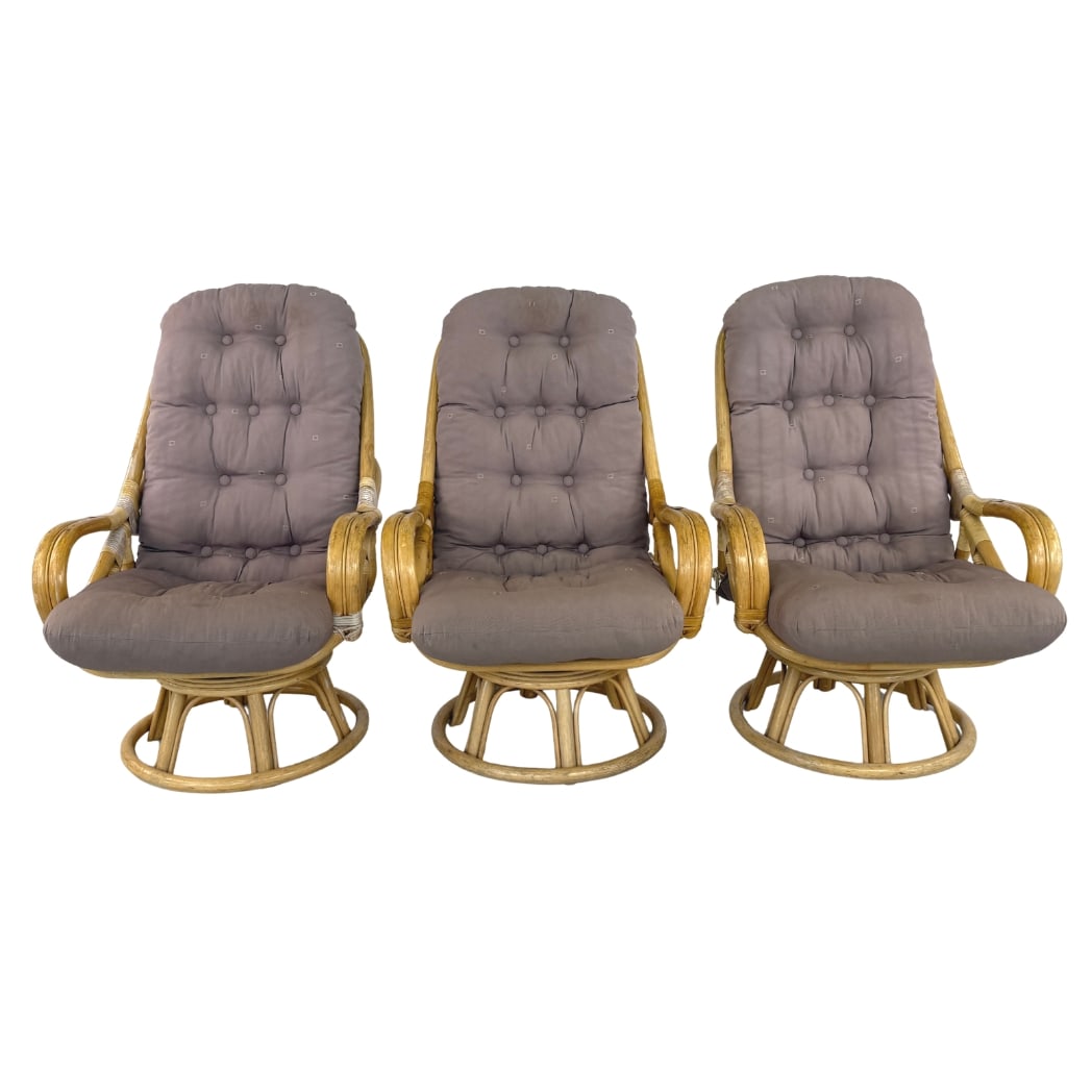 (3) DUTCH LOUNGE CHAIRS: Dimensions: H 44” x W 28.5” x D 37” x SH 19.5”. Set of 3 Vintage rattan swivel lounge chairs with egg-shaped frame and new brown/grey upholstered cushions.