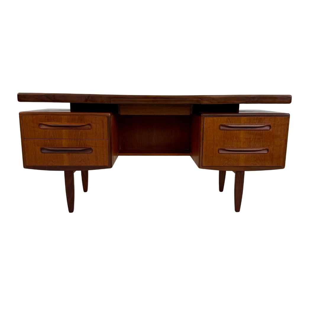 DESK BY V. WILKINS FOR G-PLAN, 1960s: Dimensions: H 28” x W 60” x D 18”. Mid-Century Modern teak desk by Victor Wilkins for G-Plan with five drawers.