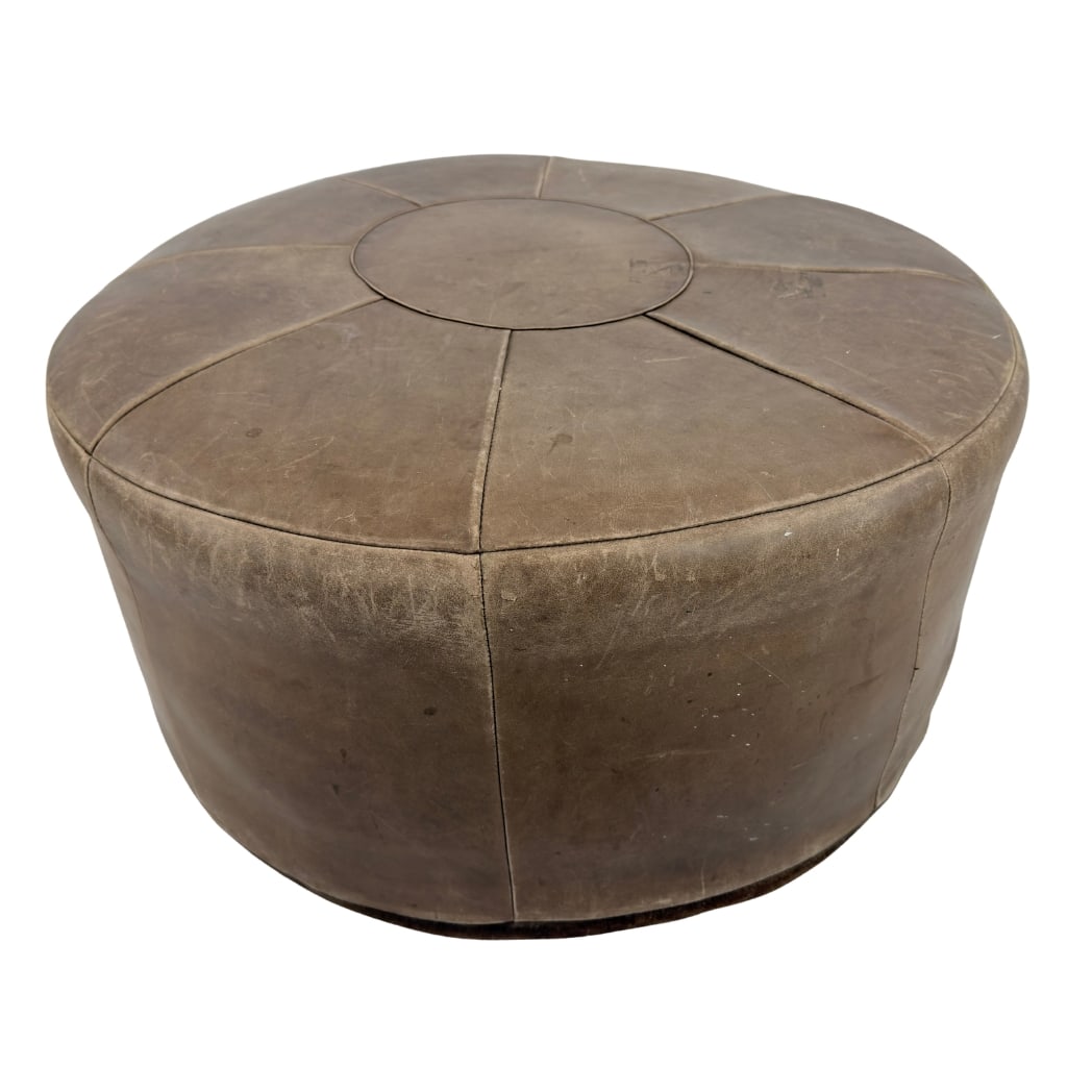 VINTAGE LEATHER POUF: Dimensions: H 15.5” x W 27.5”. Vintage Italian brown leather pouf from the 1950s.