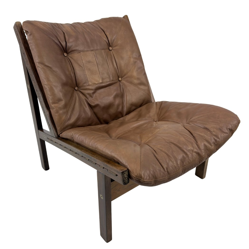 HUNTER CHAIR BY TORBJORN AFDAL FOR BRUKSBO: Dimensions: H 31” x W 24.7” x D 32.5” x SH 15.5”. Vintage Norwegian Hunter lounge chair in brown leather, designed by Torbjorn Afdal for Bruksbo in the 1960s.