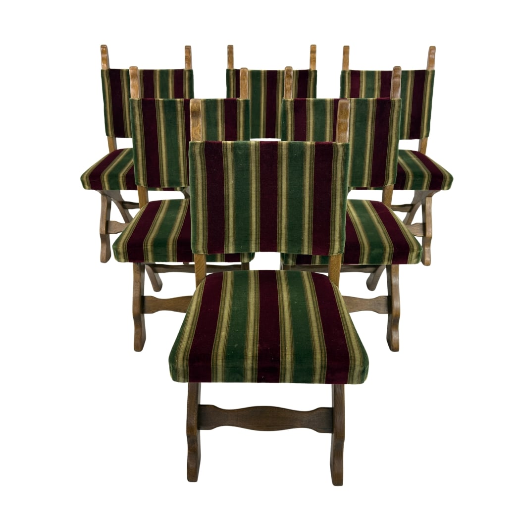 (6) BRUTALIST DINING CHAIRS: Dimensions: 37.7” x W 18.5” x SD 17.3” x SH 19.5". Set of 6 Vintage Brutalist carved oak dining chairs, upholstered in original green and red fabric.