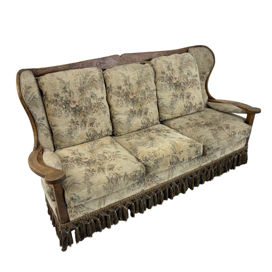 VINTAGE FRINGED THREE-SEATER SOFA: Dimensions: H 36” x W 72” x D 33” x SH 17”. Vintage Belgian three-seater sofa with original floral upholstery with fringes and solid oak frame.