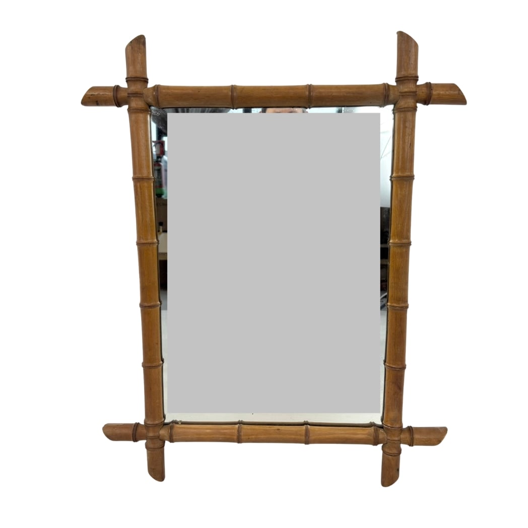 FAUX BAMBOO WALL MIRROR: Dimensions: H 28.5” x W 22.5”. Vintage French faux bamboo wall mirror.