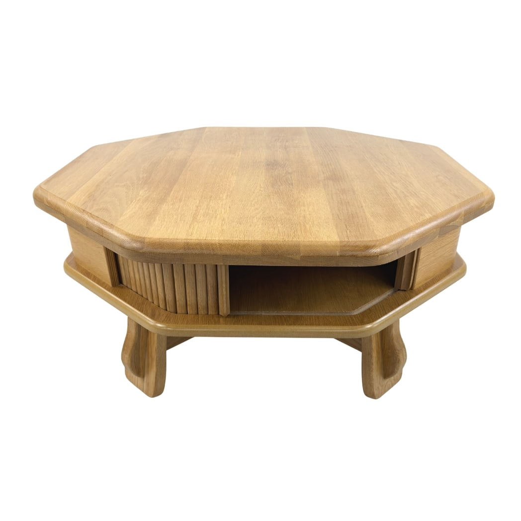 DANISH OCTAGONAL COFFEE TABLE: Dimensions: H 18.7” x W 39.3”. Vintage Danish octagonal coffee table with built-in storage with sliding slatted door.