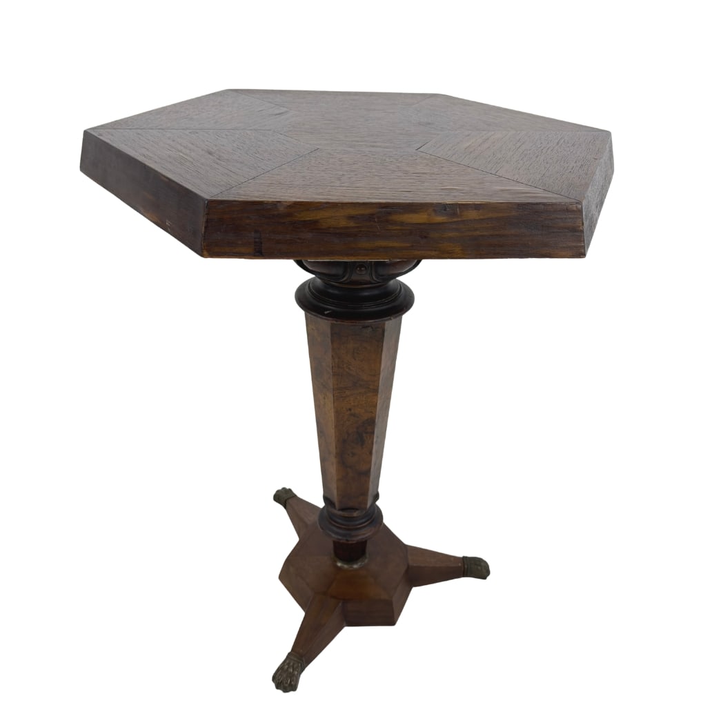 FRENCH OCTAGONAL SIDE TABLE: Dimensions: H 23.3” x W 17.5”. Victorian French octagonal side or coffee table with pedestal base and brass lion paw feet.