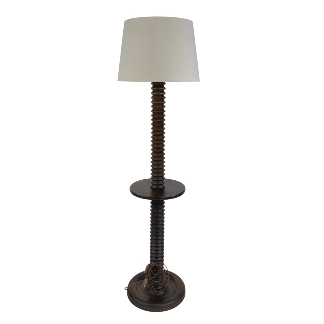 BRUTALIST FLOOR LAMP MANNER OF CHARLES DUDOUYT: Dimensions: H 58” x W 15.5”. French brutalist floor lamp with carved wood base with integrated table and off-white fabric lampshade manner of Charles Dudouyt.