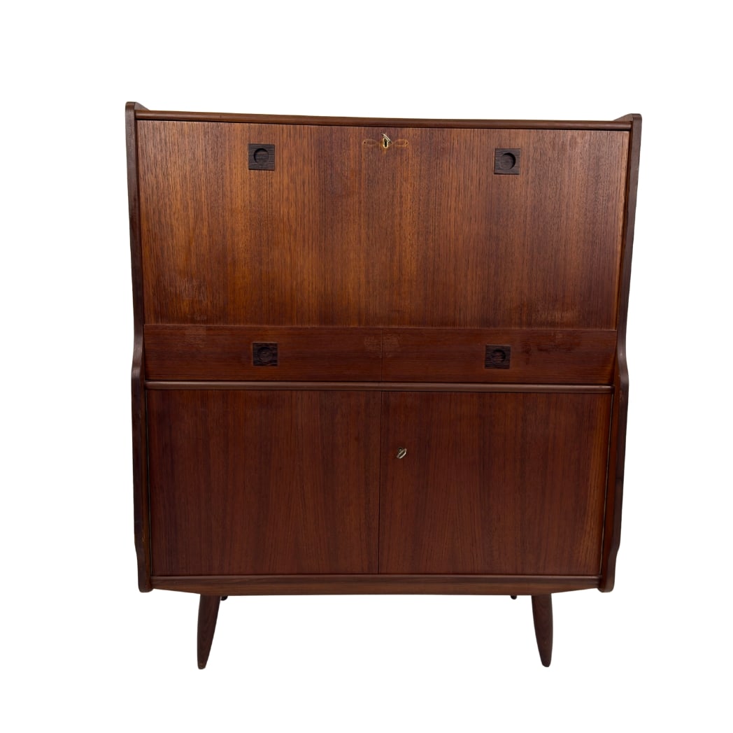 VINTAGE DUTCH SECRETAIRE: Dimensions: H 47” x W 39.3” x D 13.5”. Vintage Dutch teak secretaire with drop-front writing surface, multiple compartments for organization, one drawer and a cupboard with shelf