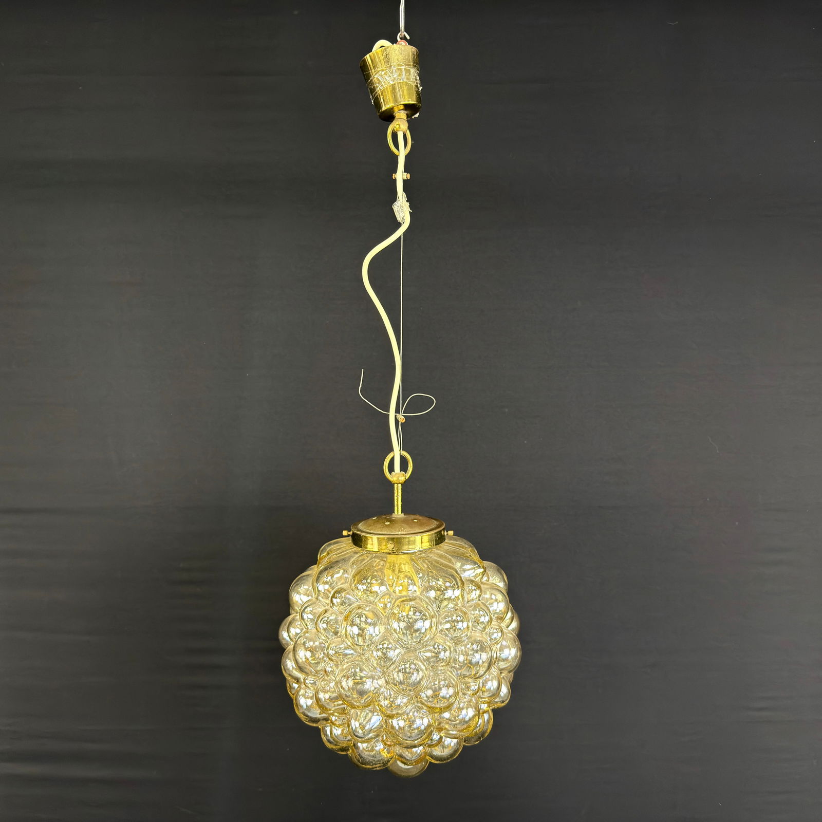 PENDANT LAMP ATTR. TO HELENA TYNELL FOR LIMBURG: Dimensions: H 31” x W 11.7”. Vintage amber hand-blown bubble glass pendant lamp attr. to Helena Tynell for Limburg, manufactured in the 1970s.