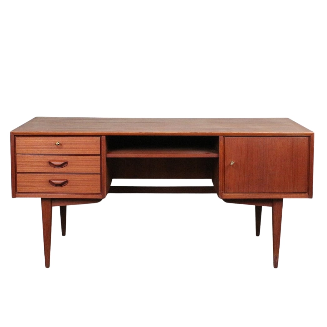 DANISH TEAK DESK, 1950s: Dimensions: H 30.3” x W 62.9” x D 29.5”. Vintage Danish teak desk attr. to Franz Ehrlich for Deutsche Werkstatten Hellerau with three drawers and one cupboard.