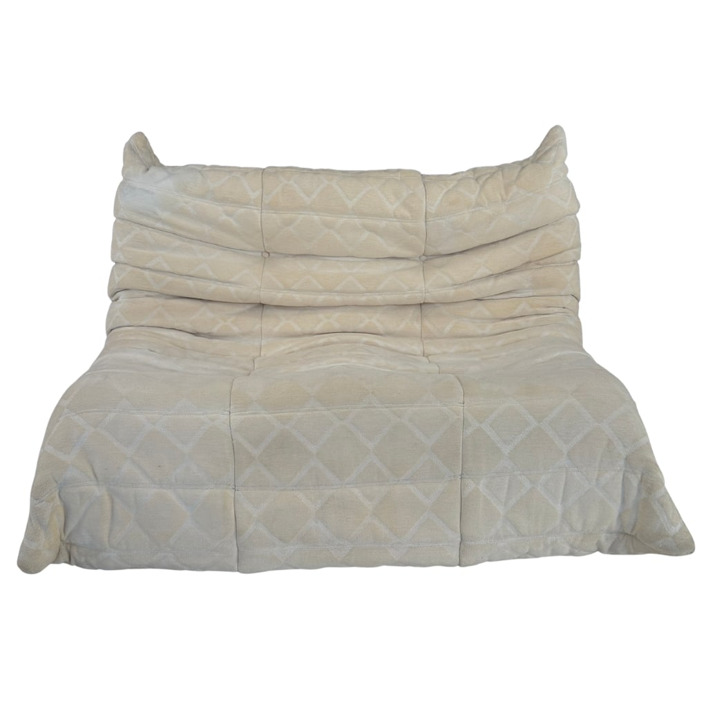 TWO-SEAT SOFA ATTR. TO LIGNE ROSET TOGO: Dimensions: H 28” W 47” x SD 21” x SH 15.5”. Togo 2-seater sofa attr. to Michel Ducaroy for Ligne Roset, with light beige upholstery. No tags visible, provenance Swiss estate.