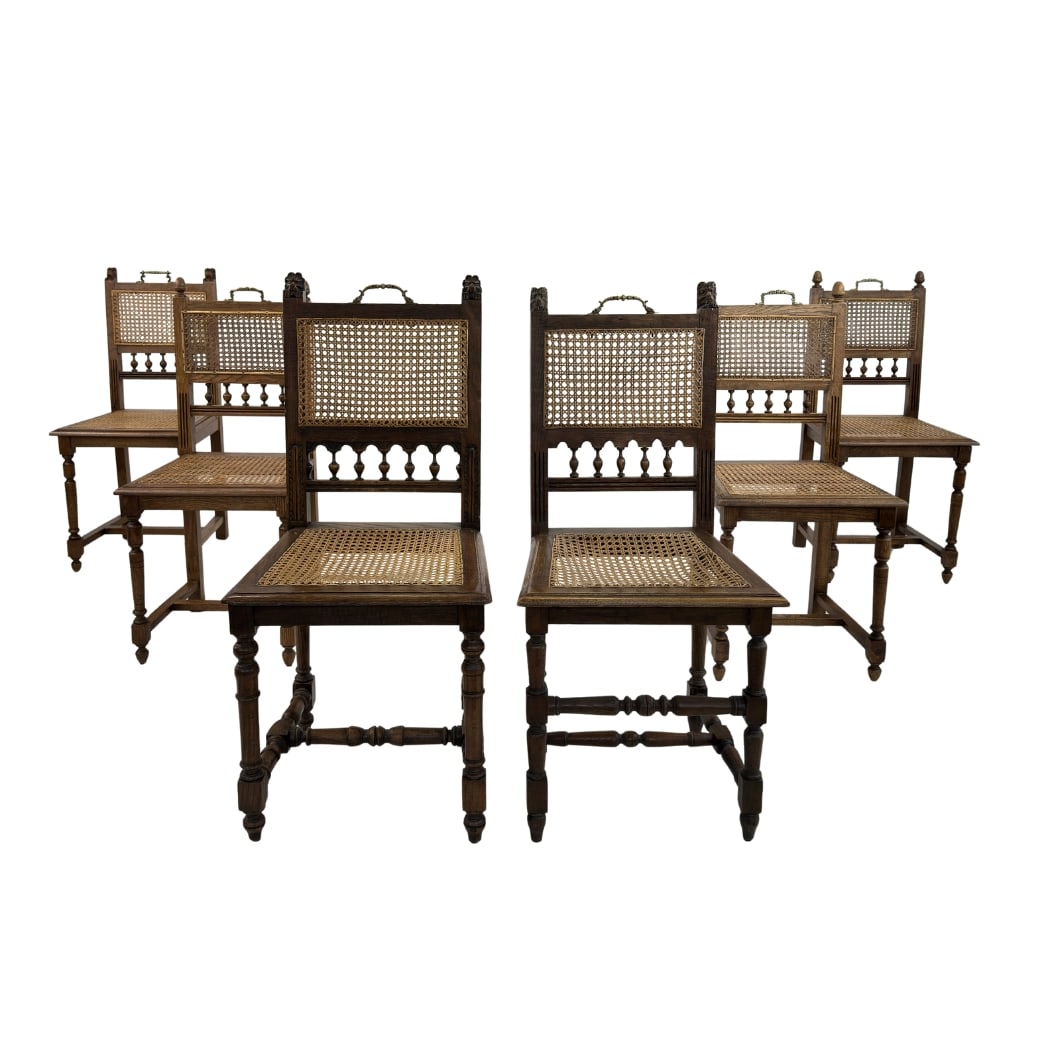 (6) ANTIQUE FRENCH DINING CHAIRS: Dimensions: H 38” x W 16.7” x SD 15.7” x SH 18.5”. Set of 6 Antique French oak dining chairs with original rattan seats and backs with decorative brass handles on top. Two of