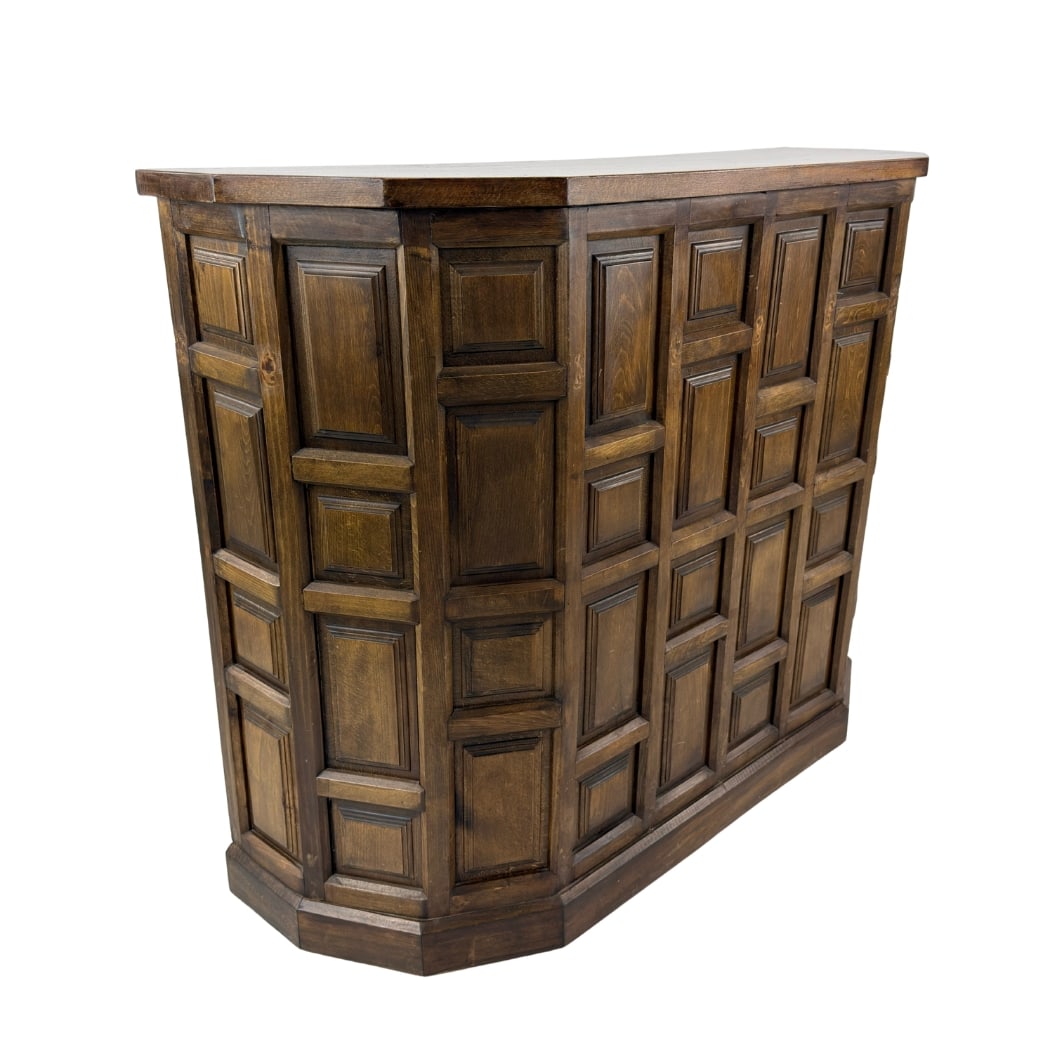 BRUTALIST OAK BAR: Dimensions: H 42” x W 53” x D 18”. Vintage Brutalist Spanish carved oak bar with three cupboards with iron handles and an open space.
