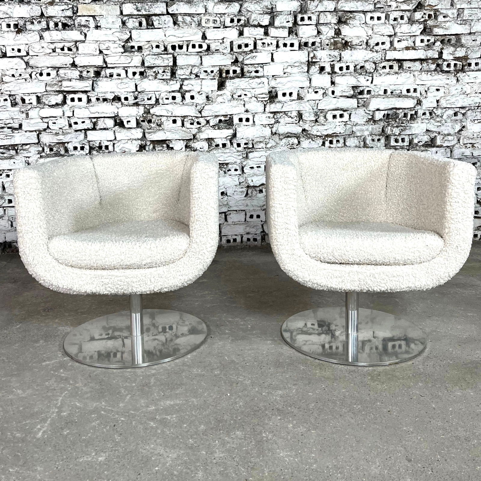 B & B ITALIA TULIP CHAIRS, A PAIR: Dimensions: H 28” x W 25.5” x SD 19” x SH 16.9”. Pair of B&B Italia Tulip designed 360-degree swivel armchairs by Jeffrey Bernett. The base is in polished and brushed
