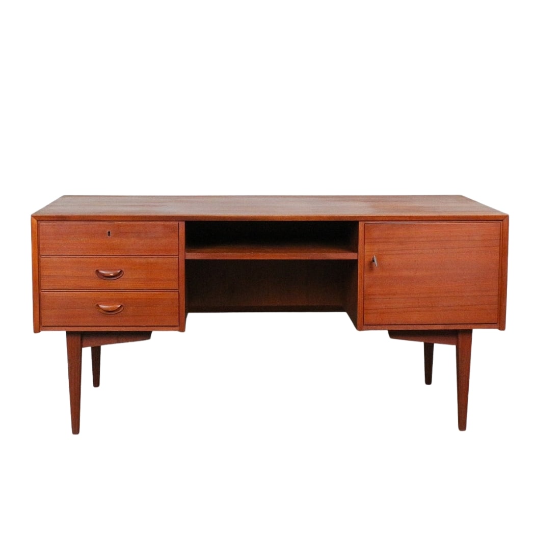 DANISH TEAK DESK ATTR. TO FRANZ EHRLICH, 1960s: Dimensions: H 30.5” x W 62.9” x D 29.5”. Vintage Danish teak desk attr. to Franz Ehrlich with three drawers on left and one cupboard with key on right, large compartment on the back.