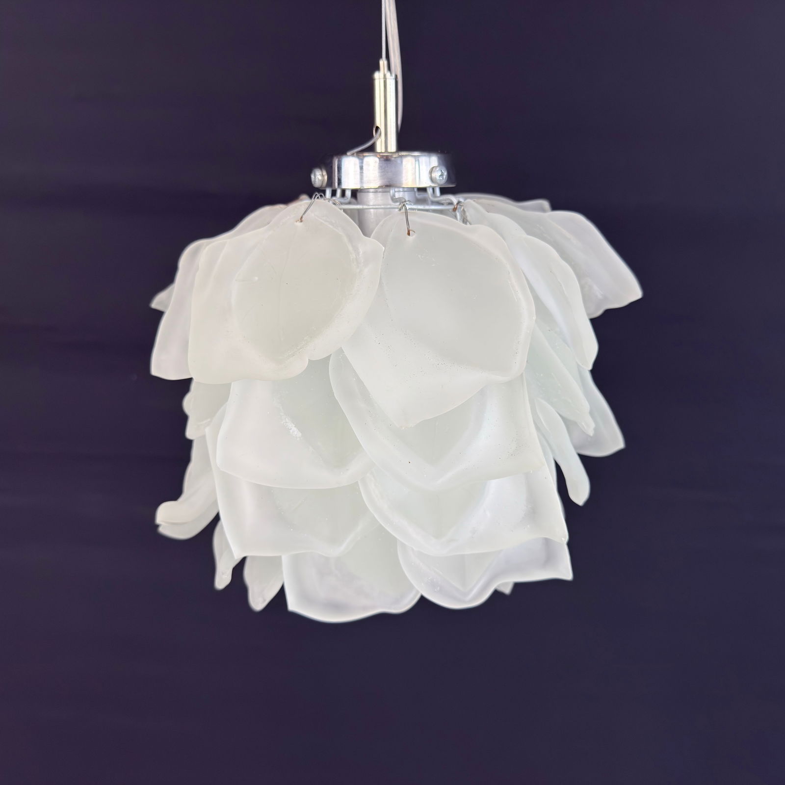 CONTEMPORARY DESIGNER CHANDELIER: Dimensions: H 11” x W 8.5”. Contemporary Belgian flower pendant chandelier with matte glass petals.