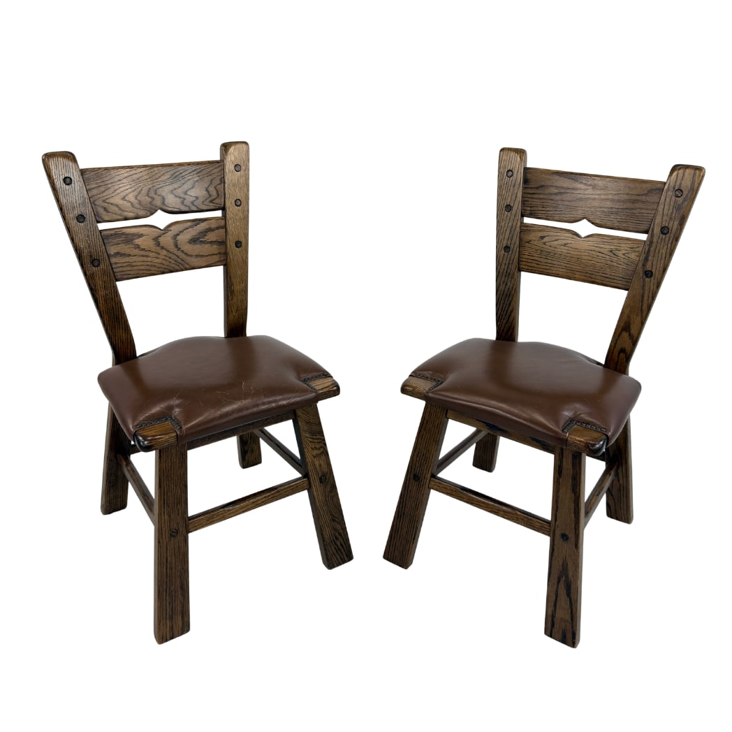 DUTCH BRUTALIST CHAIRS, A PAIR: Dimensions: H 36.5” x W 17” x SD 16” x SH 20”. Pair of Vintage Dutch Brutalist dining chairs with solid oak frame and original brown leather seats.