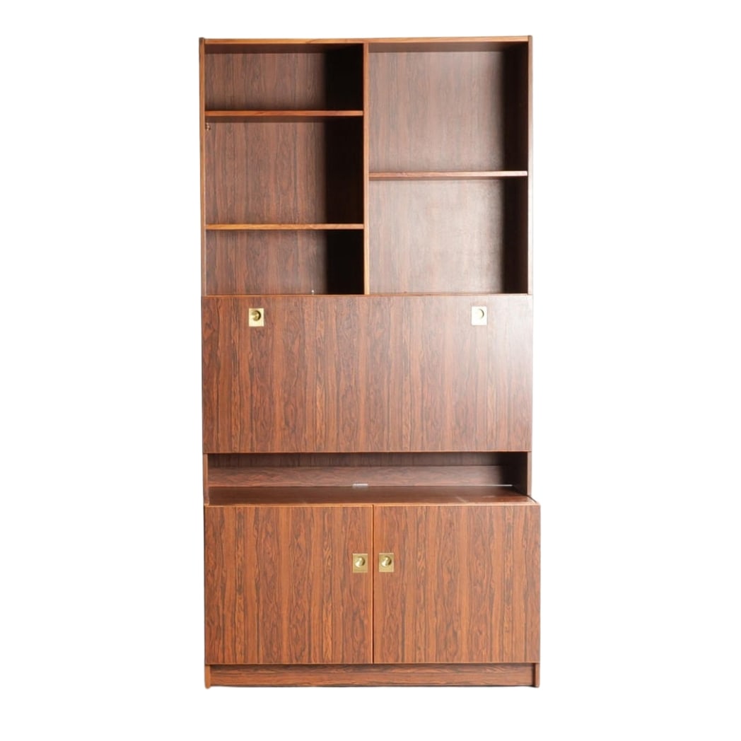 AEJM MOBLER ROSEWOOD SHELVING SYSTEM, 1970s: Dimensions: H 79.9” x W 40.9” x D 18.8”. Vintage Danish two-piece rosewood shelving system with brass handles, manufactured at AEJM Mobler in the 1960s.