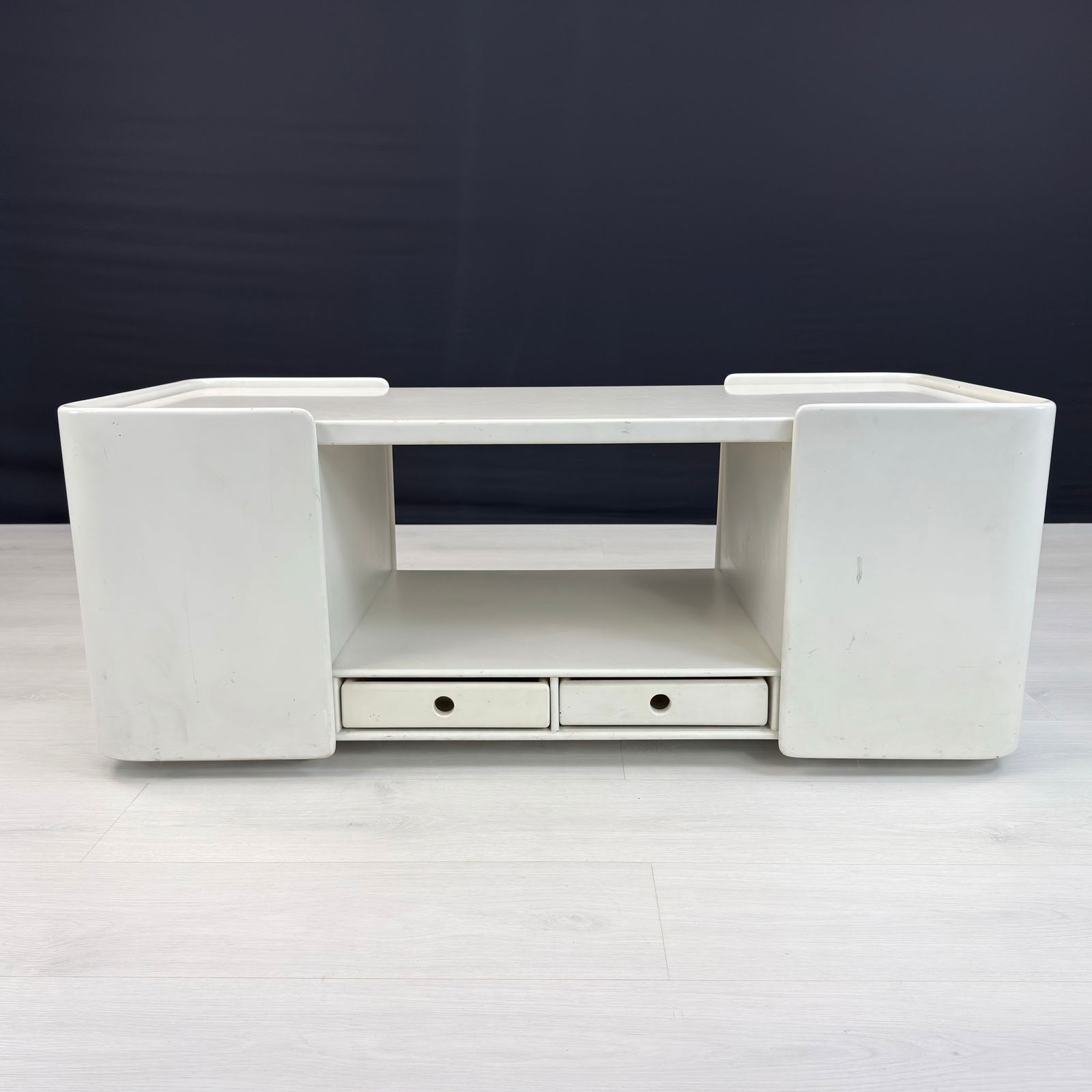 VINTAGE ITALIAN CABINET: Dimensions: H 18” x W 45.5” x D 20.5”. Vintage Italian white painted cabinet with two small central drawers and one pull-out cupboard with bottle storage 1970s