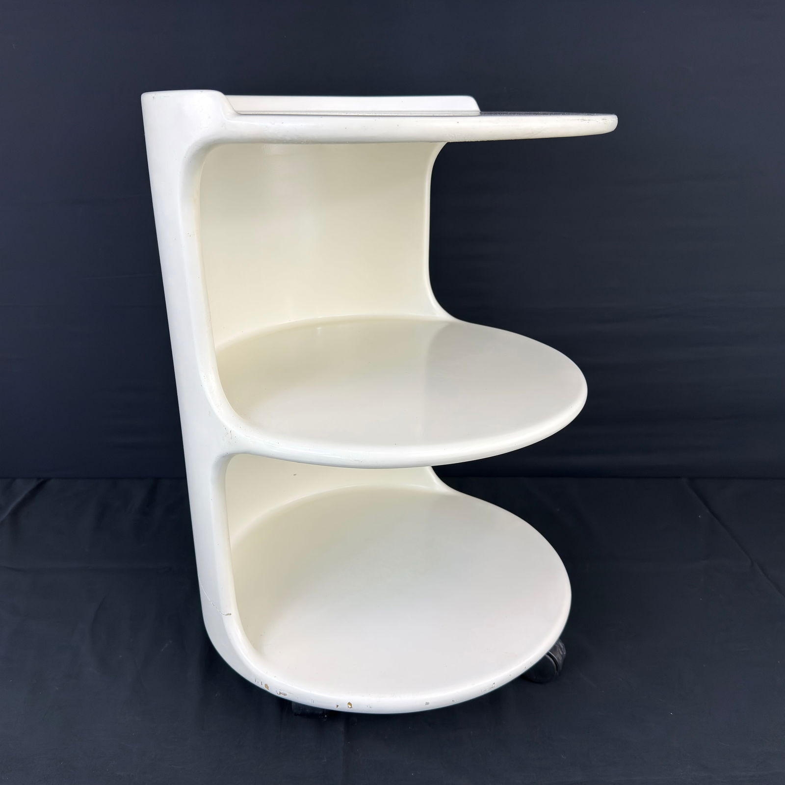 VINTAGE SPACE AGE TROLLEY: Dimensions: H 21.3” x W 16”. Vintage Space Age 3-tiet trolley or side table painted in white, on wheels from the 1970s.