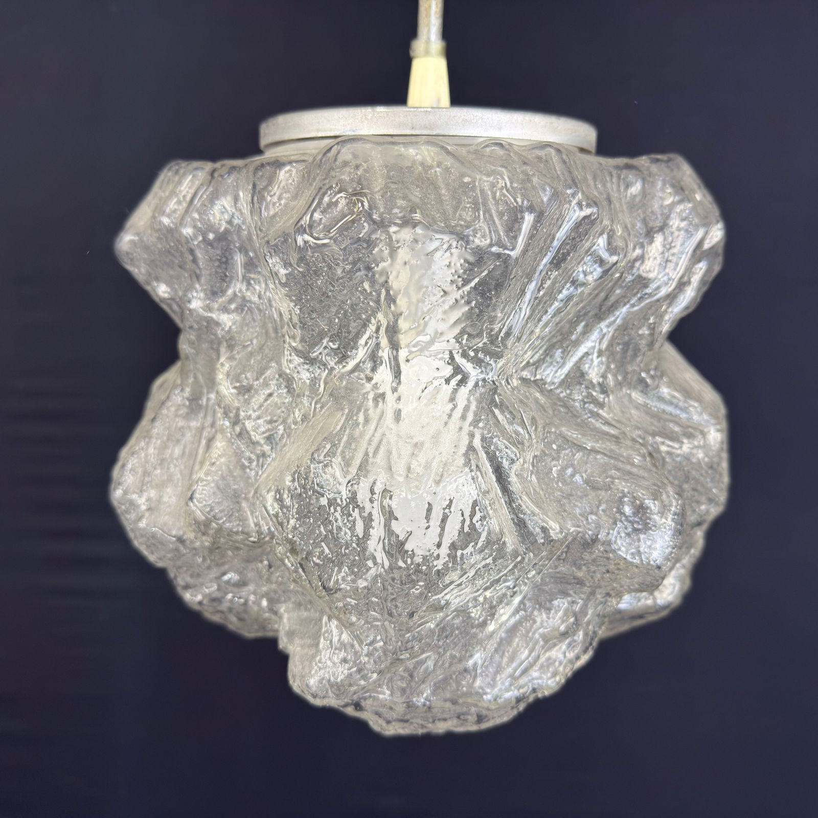 ICE GLASS PENDANT LAMP ATTR. TO PEILL & PUTZLER: Dimensions: H 28” x W 11”. Vintage Murano ice glass pendant light attr. to Peill & Putzler, manufactured in the 1970s.