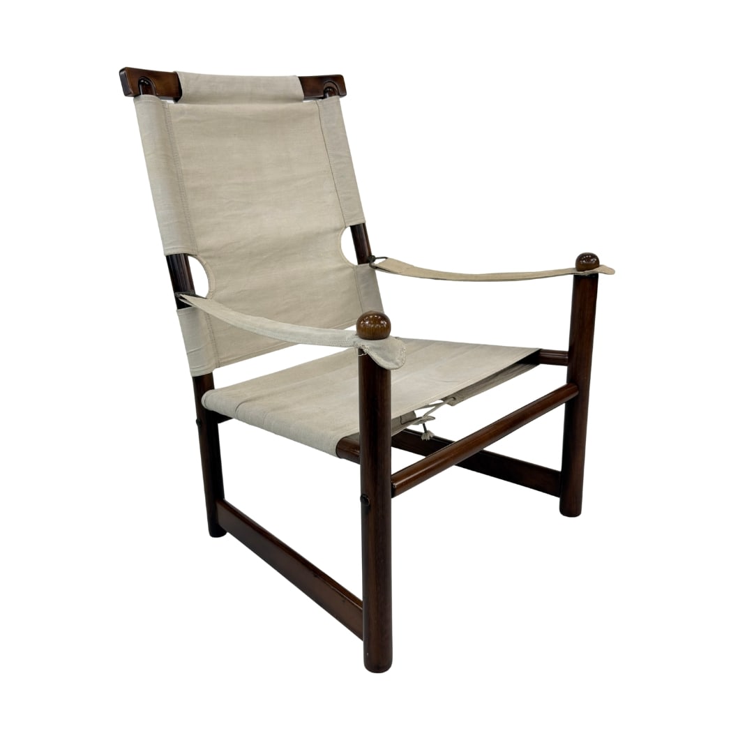 VINTAGE SAFARI ARMCHAIR, 1960s: Dimensions: H 37.5” x W 27.5” x D 30.5” x SH 15.5”. Vintage Scandinavian Safari armchair with dark wood frame and original light beige canvas.