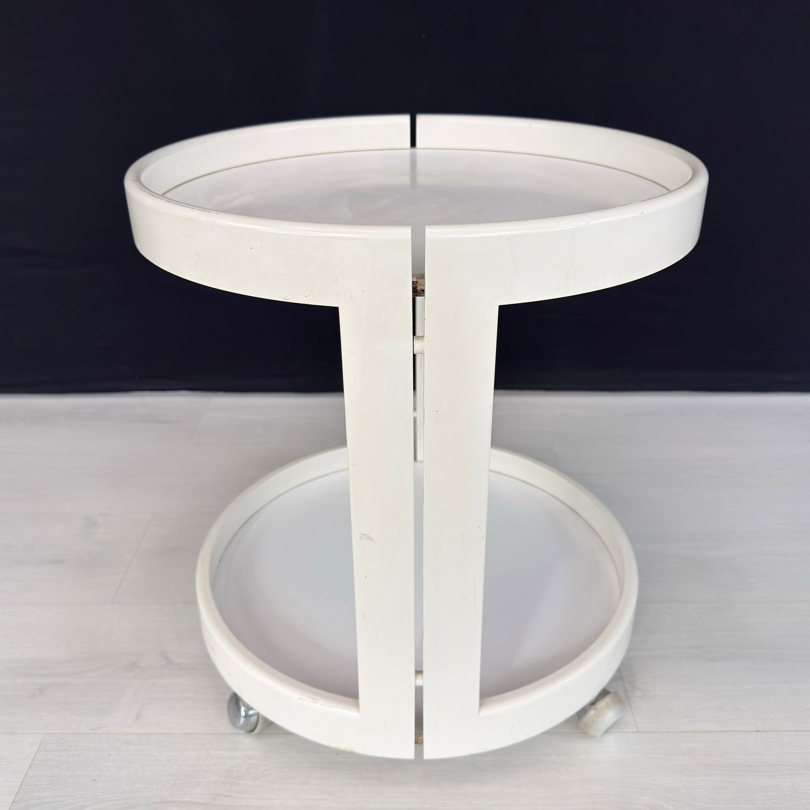 ITALIAN SPACE AGE TROLLEY, 1970s: Dimensions: H 21” x W 19”. Vintage Italian Space Age white bar trolley on wheels from the 1970s.