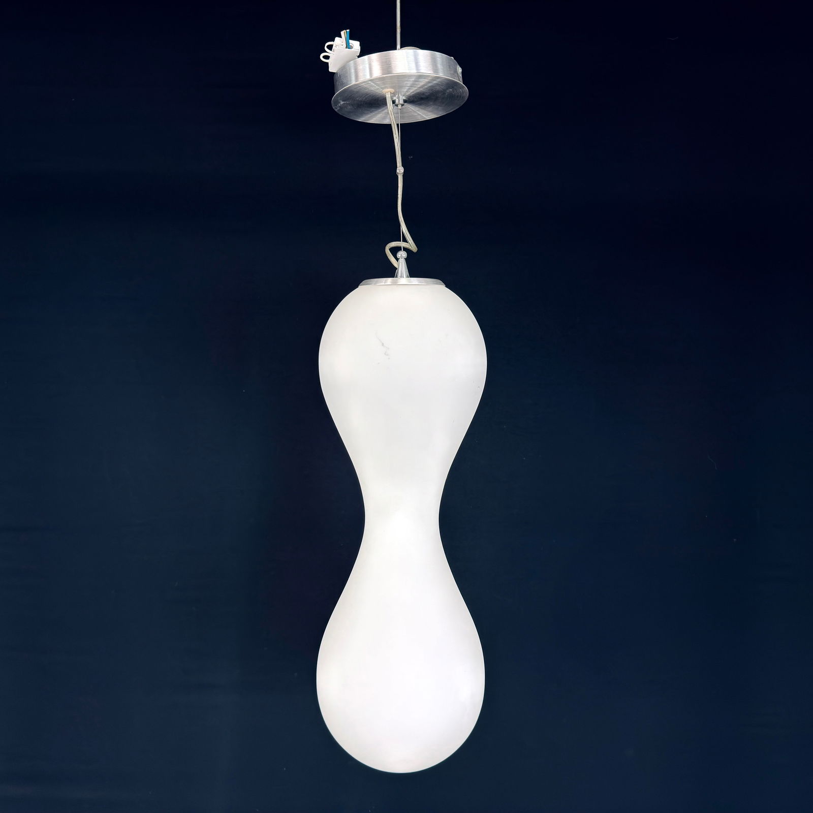 PRIMALUCE PENDANT LIGHT: Dimensions: H 30.5” x W 7.5”. Italian hourglass-shaped pendant light designed by Primaluce Venezia.
