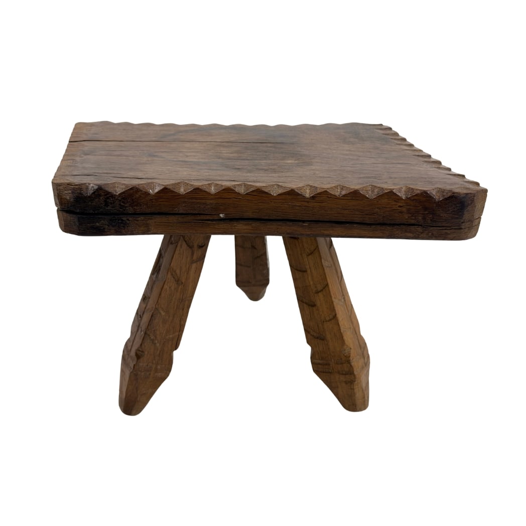 BRUTALIST HAND-CARVED MILKING STOOL: Dimensions: H 12” x W 16” x D 10”. Vintage brutalist hand-carved wooden tripod milking stool.