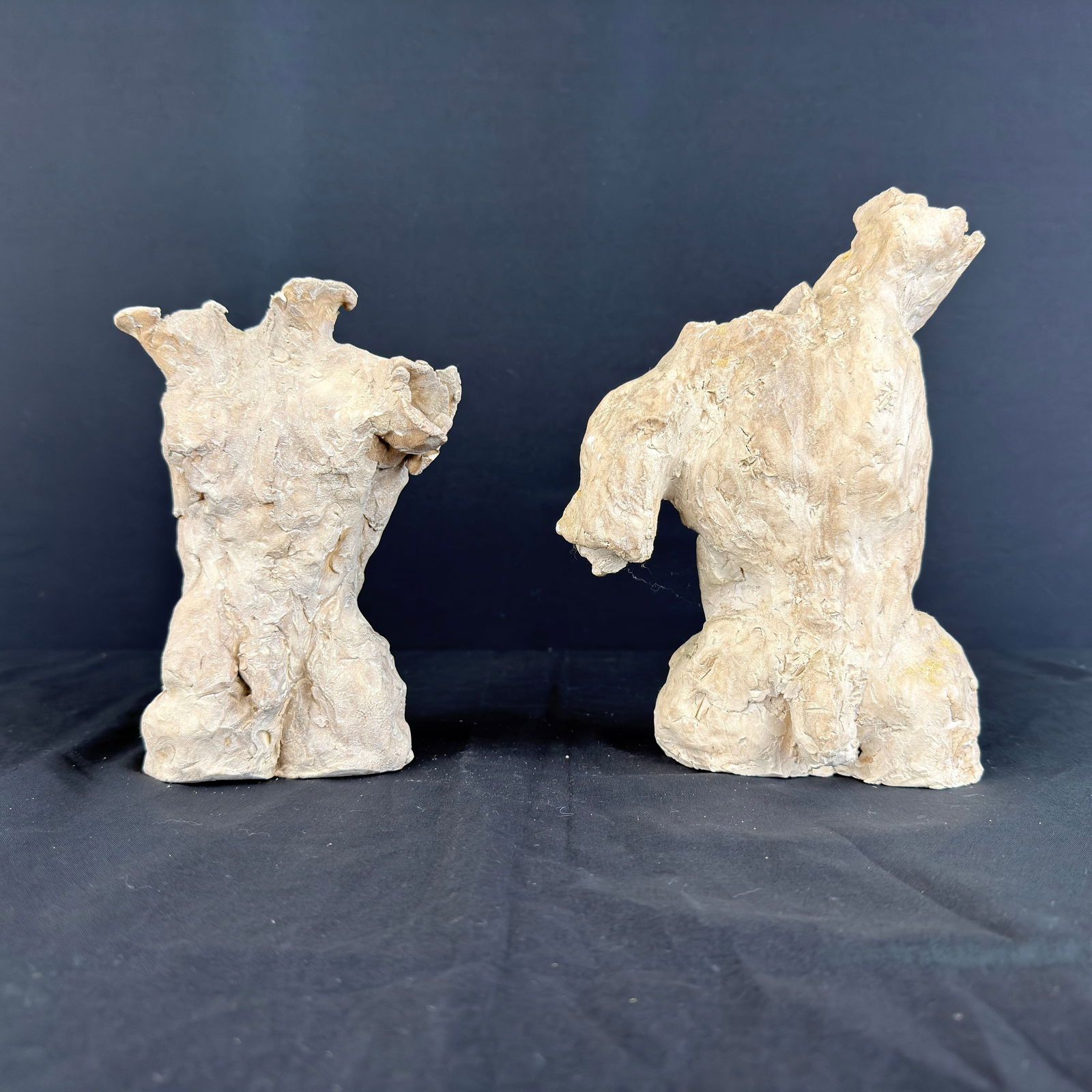 VINTAGE CLAY SCULPTURES, A PAIR: Dimensions: H 9.5” x W 4.5”. Pair of Vintage hand carved clay sculptures. Dimensions: (2nd sculpture) H 8” x W 4”.
