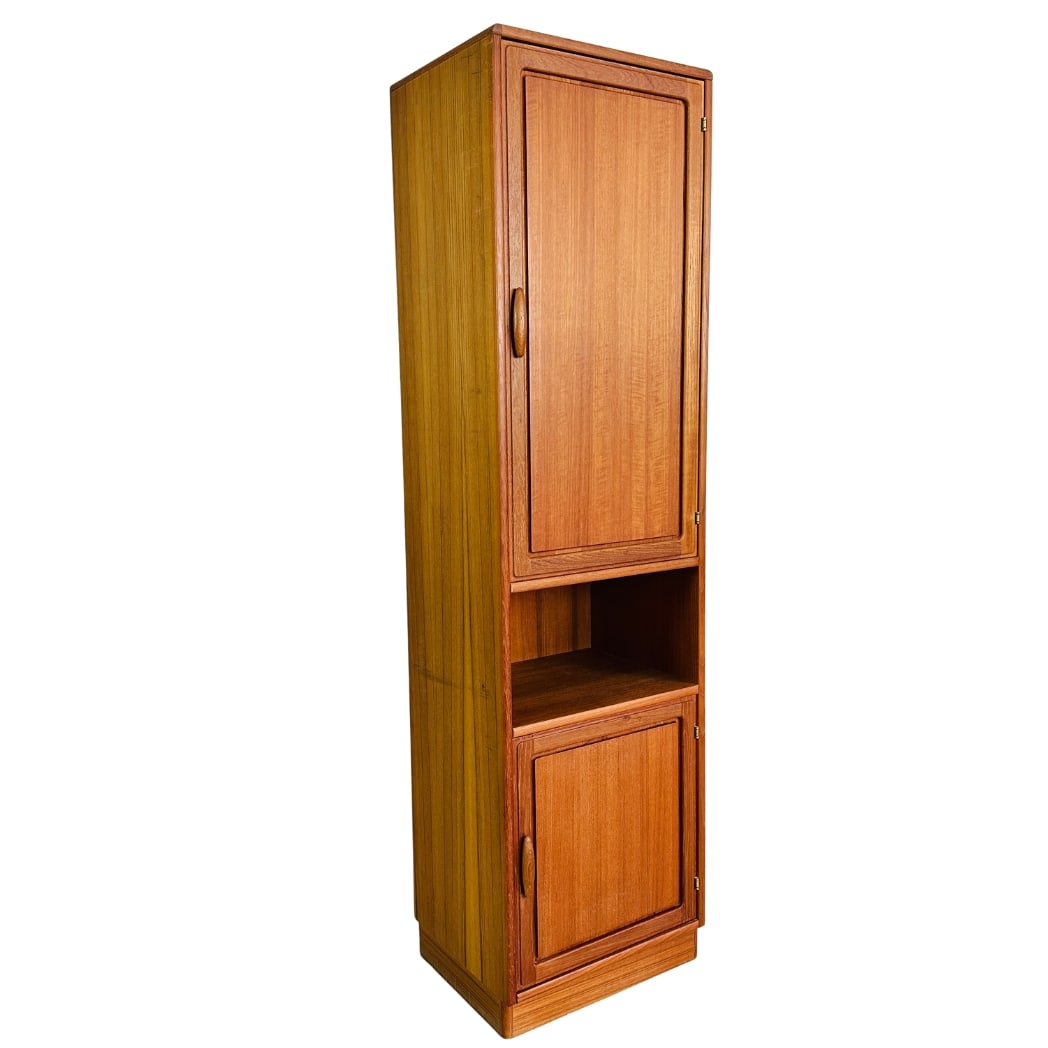 DYRLUND TEAK CABINET, 1960s: Dimensions: H 74.5” x W 20.5” x D 16”. Vintage Danish Dyrlund teak tall cabinet with shelves inside from the 1970s.