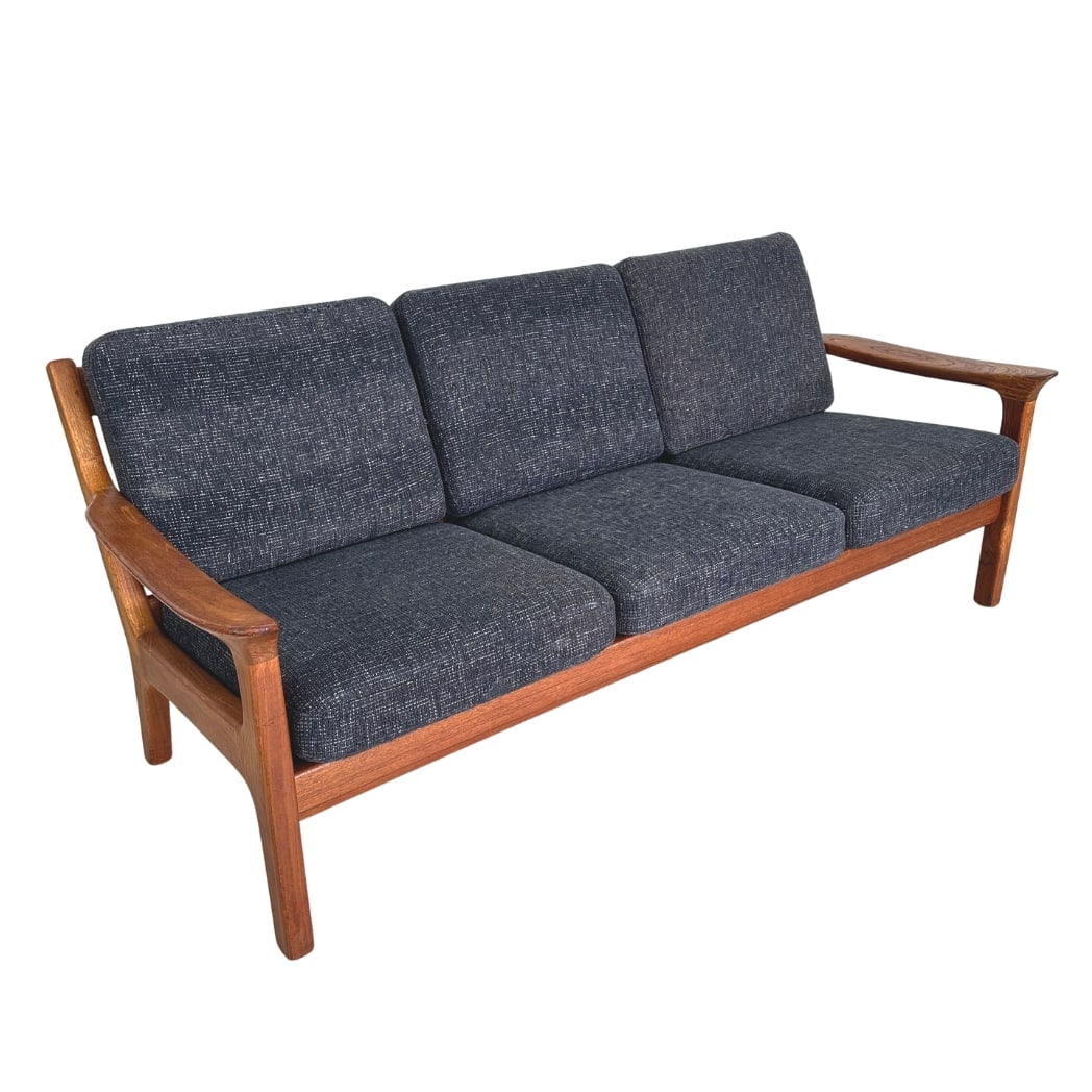 SCANDINAVIAN THREE-SEATER SOFA: Dimensions: H 30” x W 73.5” x D 29” x SH 17.5”. Vintage Danish teak three-seater sofa manner of Ole Wanscher for Cado, upholstered in dark grey fabric.