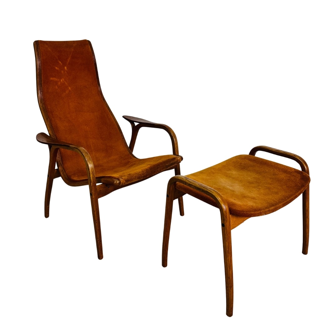 YNGVE EKSTROM LAMINO EASY CHAIR WITH OTTOMAN, 1970s: Dimensions: H 39” x W 27.5” x D 27.7” x SH 16.5". Scandinavian cognac leather Lamino easy chair with ottoman by Yngve Ekstrom for Swedese with bentwood teak construction.