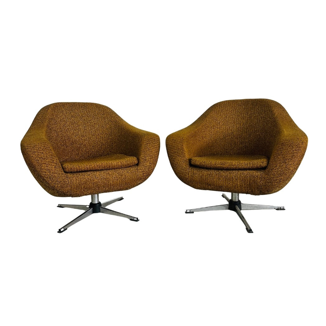 SWIVEL EGG CHAIRS ATTR. TO OVERMAN MFG, A PAIR: Dimensions: H 28.5” x W 32” x D 25.5” x SH 15.7”. Pair of Vintage swivel egg chairs attr. to Eric Carl Klote for Overman MFG, upholstered in brown/gold fabric.