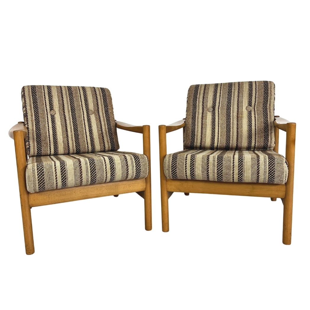 WALTER KNOLL LOUNGE CHAIRS, A PAIR: Dimensions: H 30” x W 27” x D 28” x SH 17”. Pair of Vintage teak lounge chairs designed by Walter Knoll in the 1960s with striped fabric cushions.