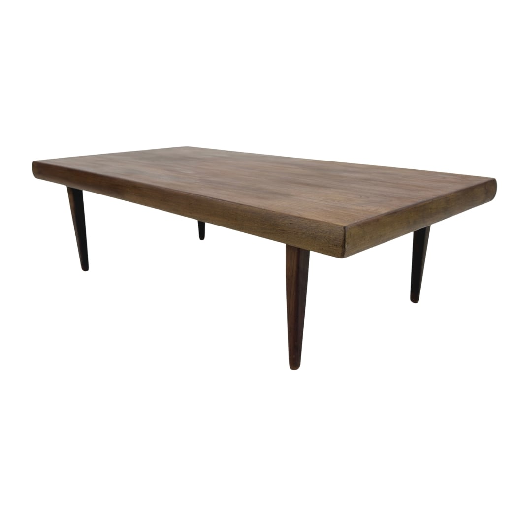 COFFEE TABLE MANNER OF ERIK SEVERIN HANSEN: Dimensions: H 16” x W 55” x D 28.5”. Vintage Danish low coffee table manner of Erik Severin Hansen for Haslev with four tapered legs.