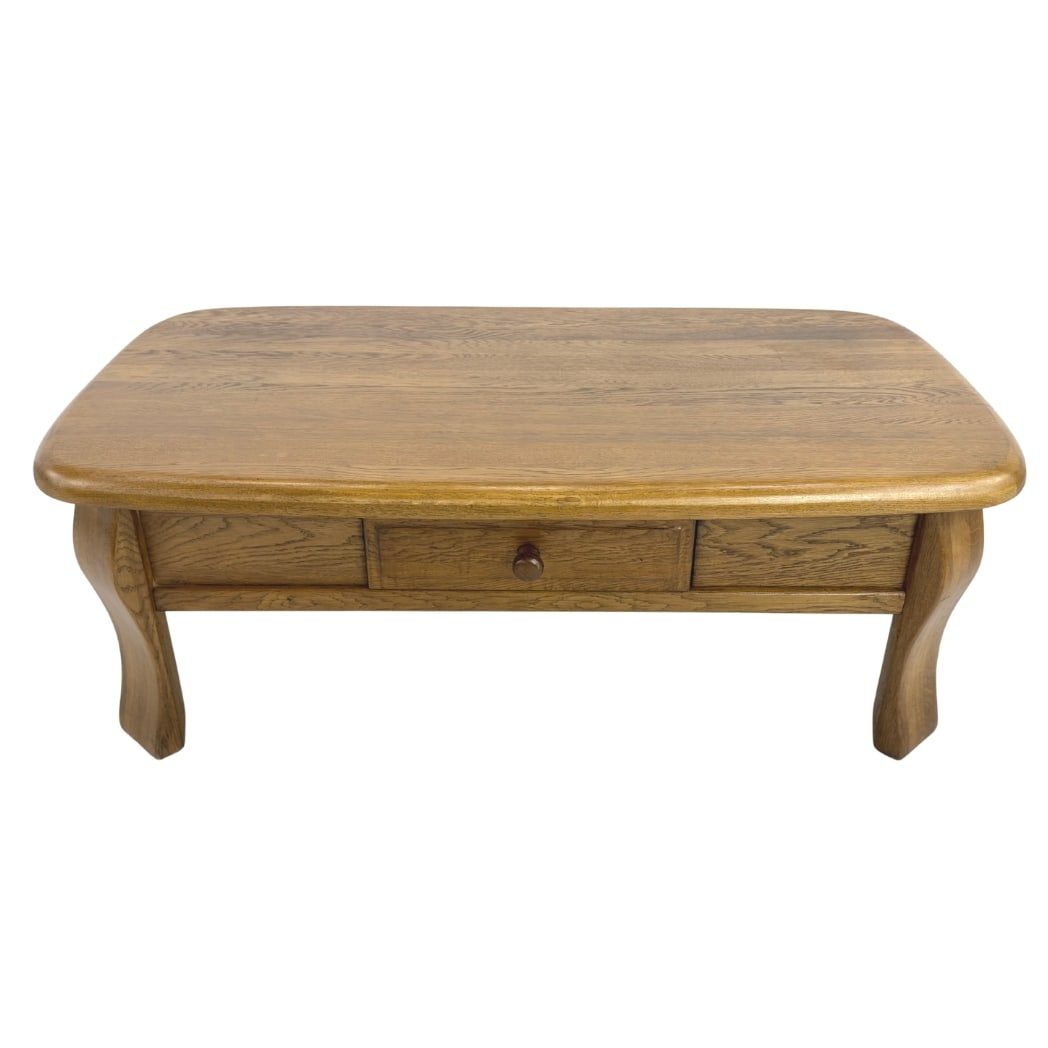 DUTCH OAK COFFEE TABLE: Dimensions: H 17.5” x W 50” x D 28”. Vintage Dutch brutalist oak coffee table with one large central drawer opens from both sides.