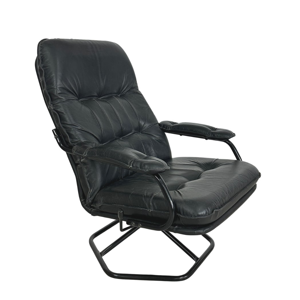 DANISH UNICO SWIVEL ARMCHAIR: Dimensions: H 36” x W 27.5” x SD 19.7” x SH 16”. Danish black leather swivel and reclining armchair by Unico from the 1970s.