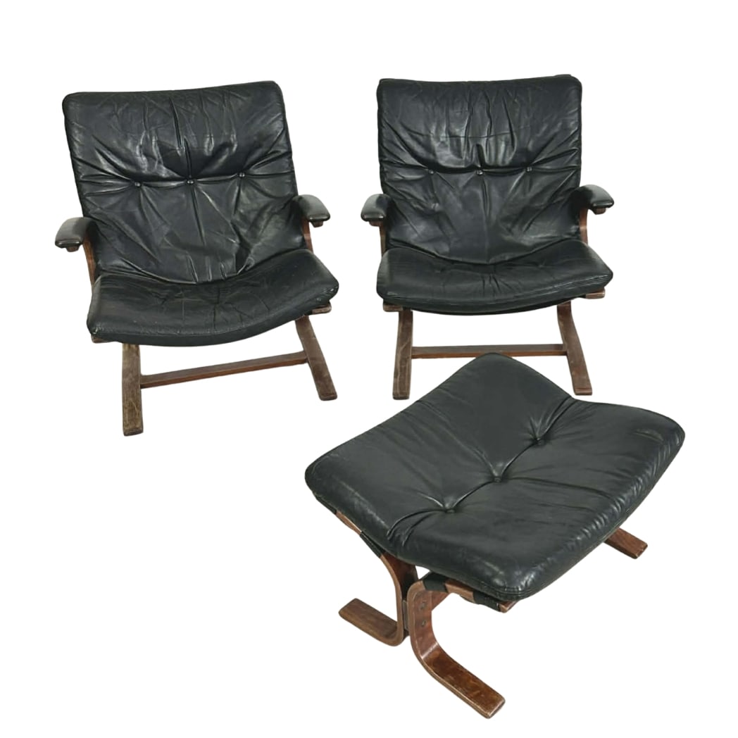(2) KENGU-ARMCHAIRS WITH OTTOMAN BY ELSA & NORDAHL SOLHEIM: Dimensions: H 30” x W 27.5” x SD 19.5” x SH 15.5”. Pair of Vintage Kengu-Armchairs with matching ottoman in black leather, designed by Elsa & Nordahl Solheim for Rybo Rykken.