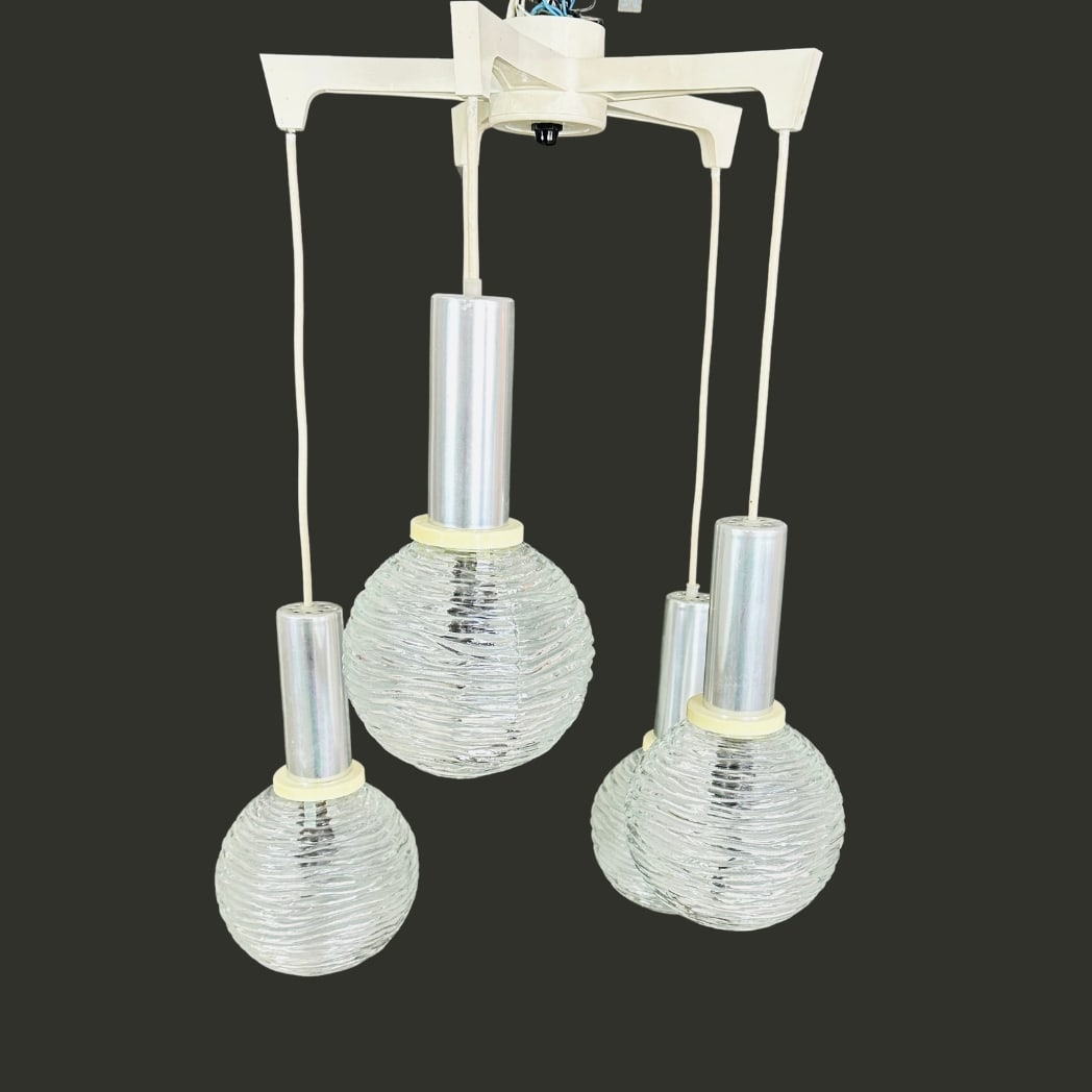 SPACE AGE CASCADE PENDANT LAMP: Dimensions: H 27.5” x W 17”. Vintage Space Age Cascade pendant lamp with 5 embossed glass globe shades from the 1970s.