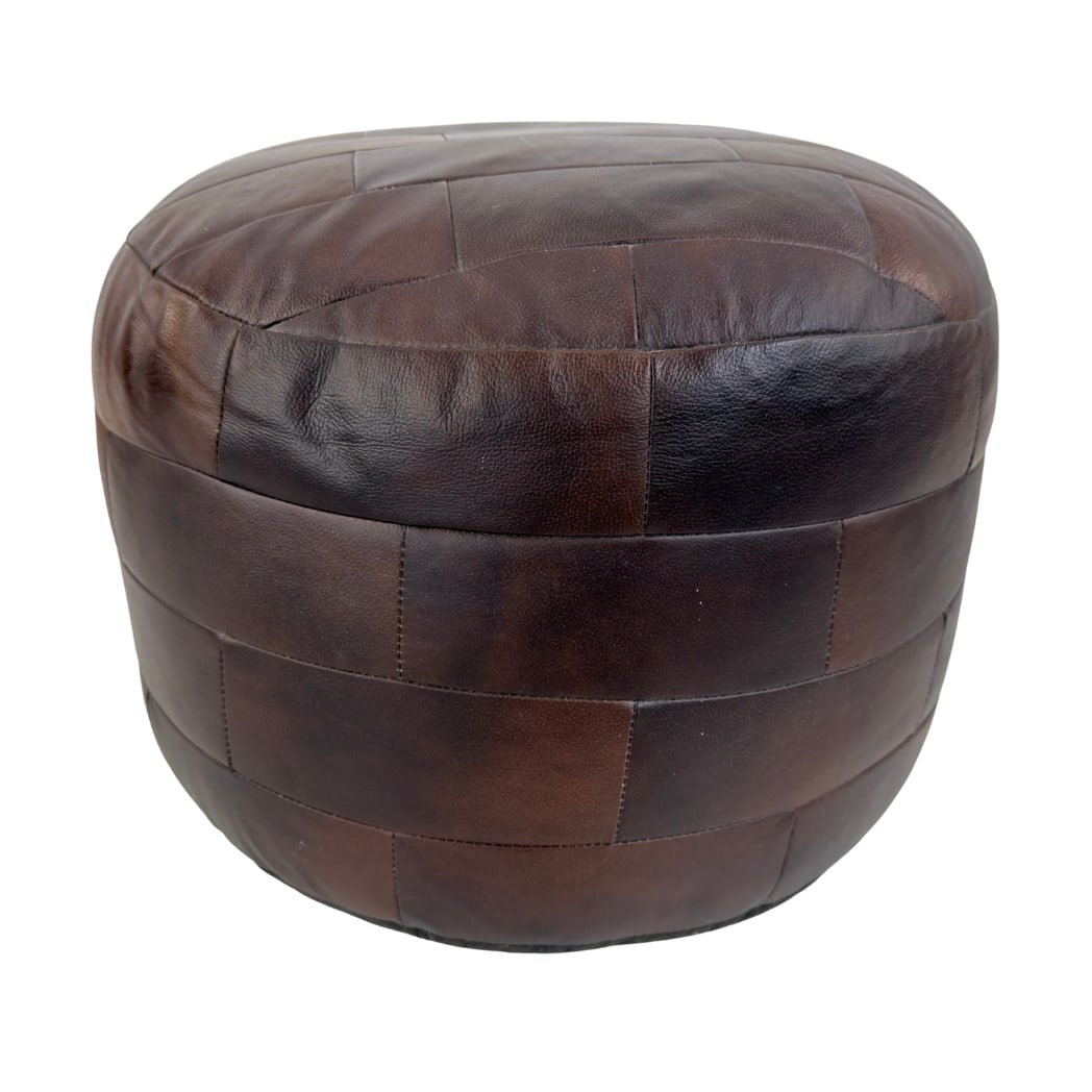 DE SEDE LEATHER POUF: Dimensions: H 16” x W 18.5”. Vintage De Sede brown leather patchwork pouf.