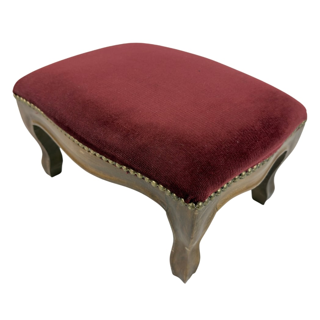 VINTAGE FRENCH FOOTSTOOL: Dimensions: H 9” x W 15.3” x D 10.5”. Vintage French footstool in original red velvet upholstery with nailhead trim detail and cabriole legs.
