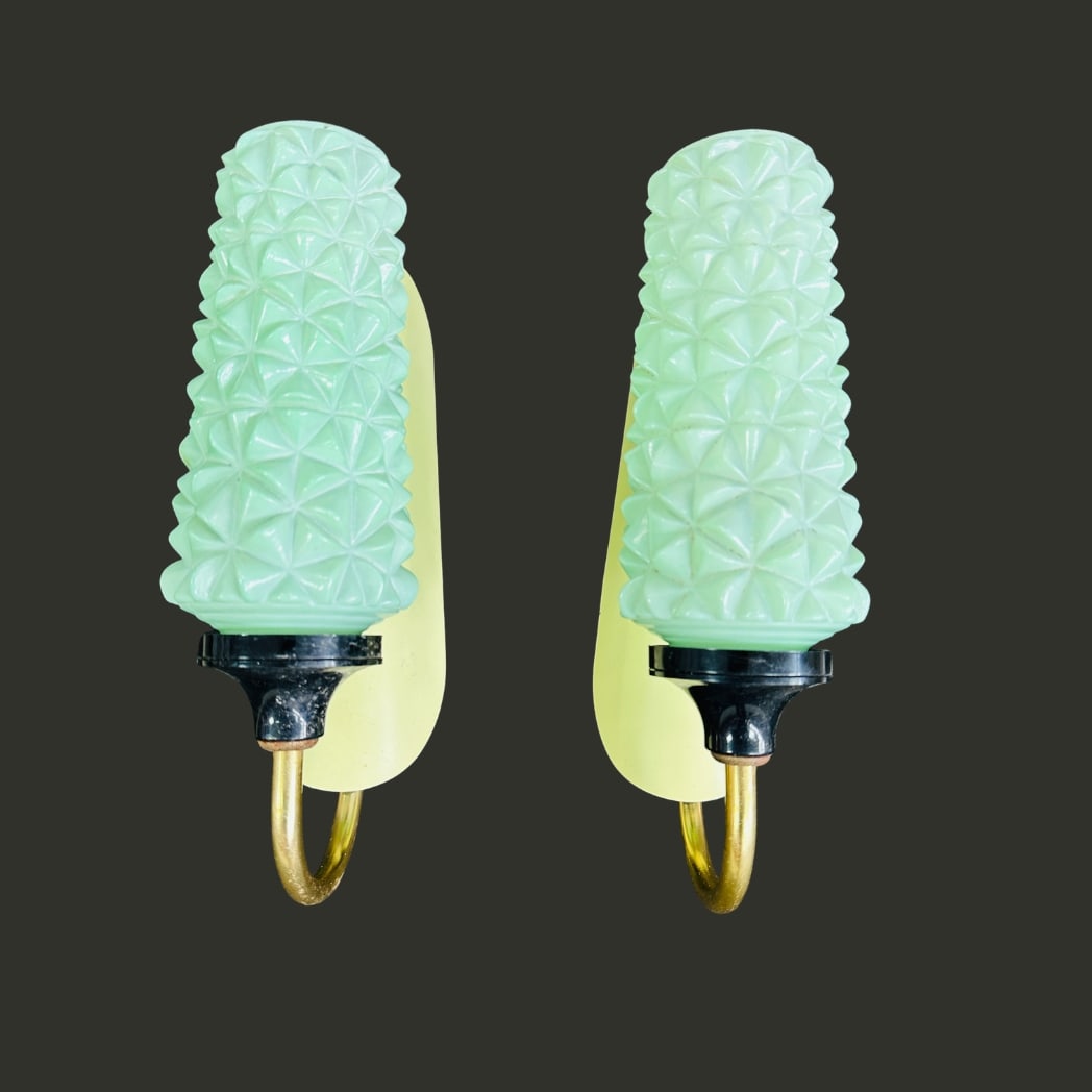 BRASS AND GLASS WALL SCONCES, A PAIR: Dimensions: H 10.5” x W 2.7” x D 5.5”. Pair of Vintage Art Deco brass wall sconces with green textured glass shades.