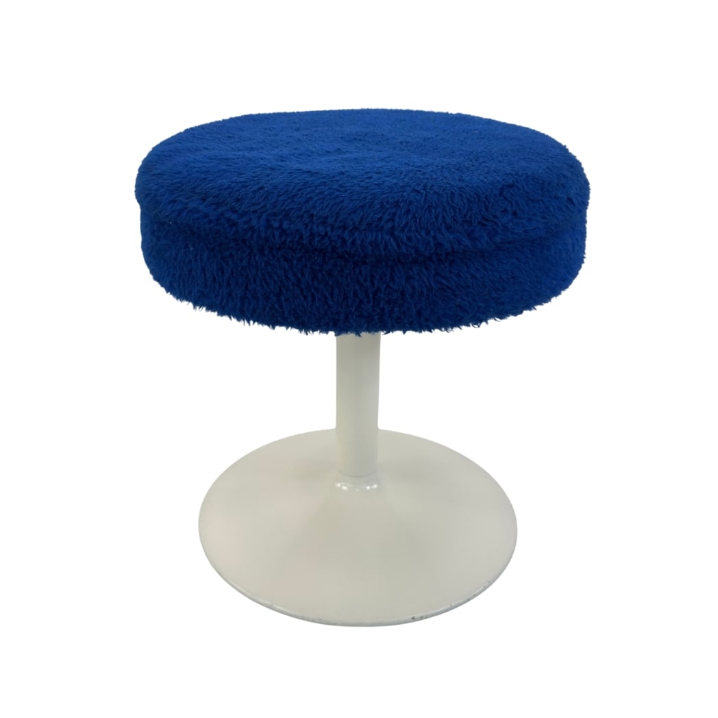 VINTAGE SPACE AGE STOOL, 1970s: Dimensions: H 18” x W 16.7”. Vintage Space Age stool with blue faux fur and white tulip base.