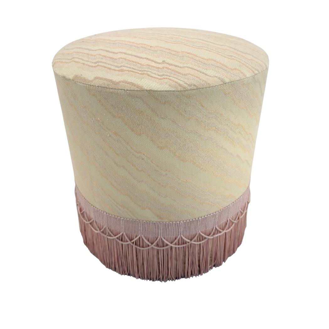 FRENCH FRINGE OTTOMAN: Dimensions: H 14” x W 12.7”. Vintage French round ottoman in original beige fabric with fringes.