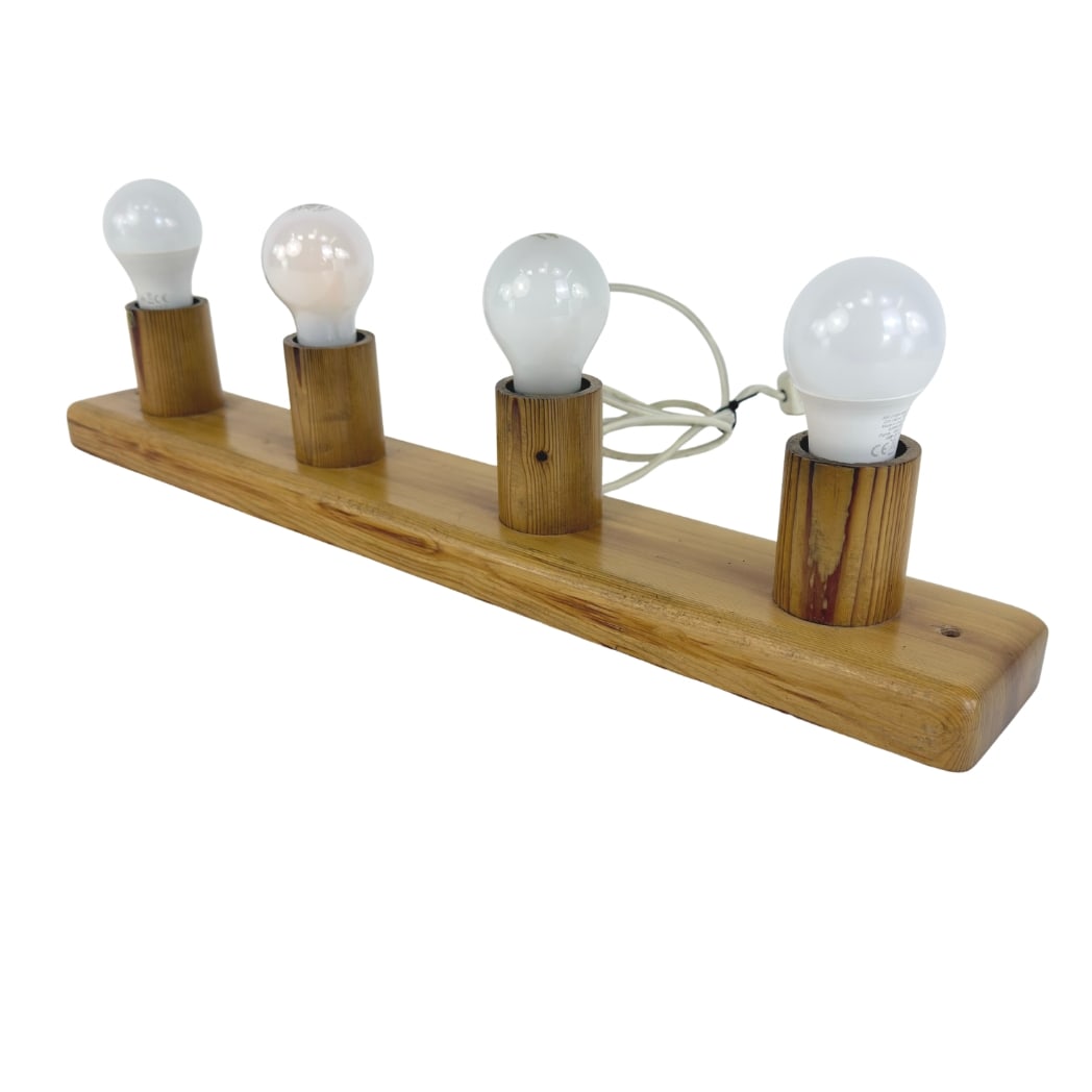 SCANDINAVIAN CEILING LIGHT: Dimensions: W 25” x D 3.5”. Vintage Scandinavian wall or ceiling light with pine base and 4 lights.