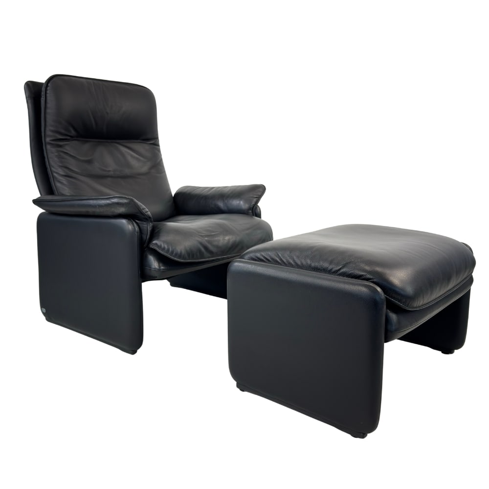 DE SEDE DS 61 ARMCHAIR WITH OTTOMAN: Dimensions: H 37” x W 30” x D 34” x SH 17”. Swiss black leather armchair with ottoman from De Sede DS 61, 1960s. Dimensions: (ottoman) H 17” x W 26.5” x D 21”