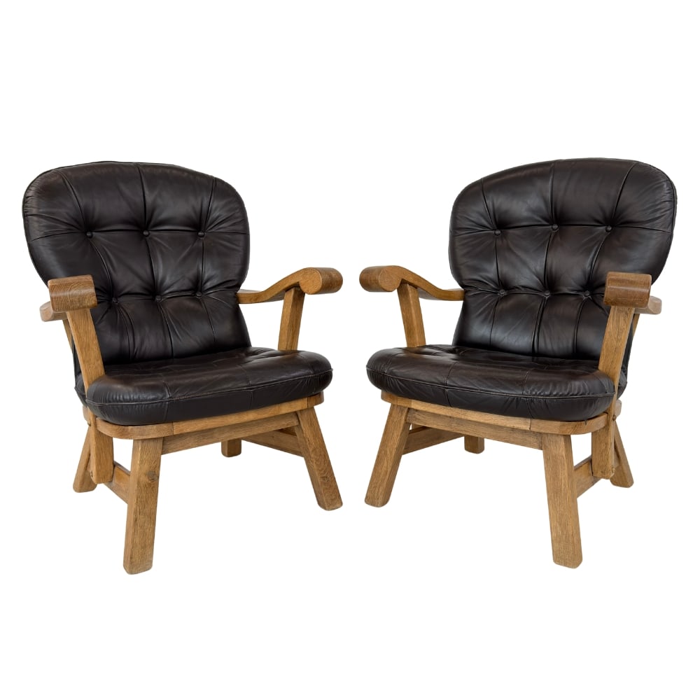 DANISH BRUTALIST ARMCHAIRS, A PAIR: Dimensions: H 39” x W 30” x D 31” x SH 18”. Pair of Danish Brutalist dark brown leather armchairs with loose padded cushions.