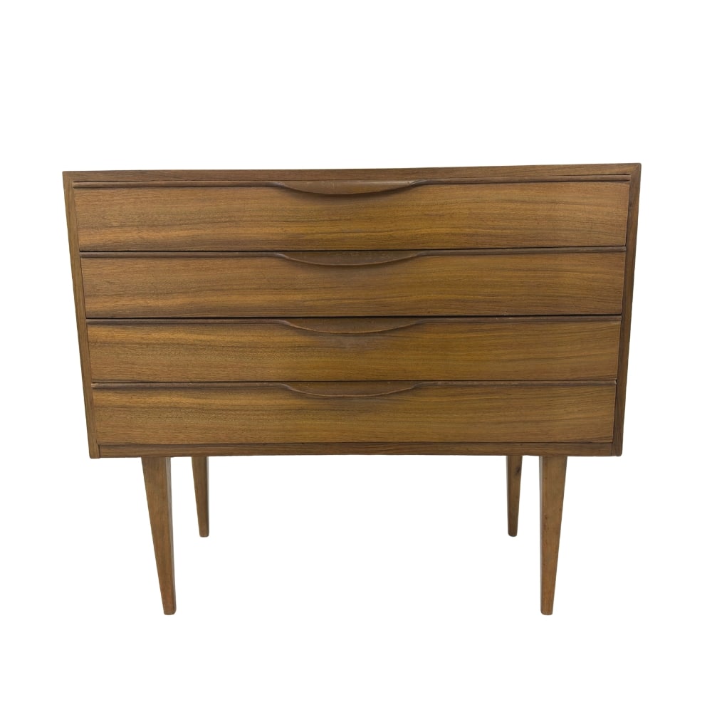 DANISH CHEST OF DRAWERS MANNER OF JENS RISOM, 1960s: Dimensions: H 24.5” x W 27.5” x D 13”. Vintage Danish chest of drawers manner of Jens Risom with 4 drawers with sculpted pull handles.