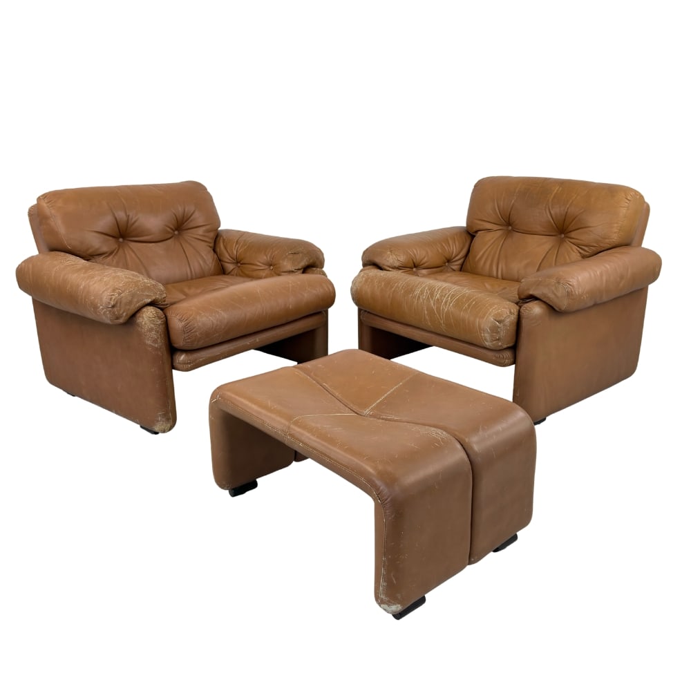 (2) B&B ITALIA LOUNGE CHAIRS WITH OTTOMAN: Dimensions: H 28” x W 38.5” x D 37.5” x SH 18.5”. Pair of Coronado lounge chairs with ottoman in brown leather designed by Afra and Tobia Scarpa for B&B Italia. Dimensions: