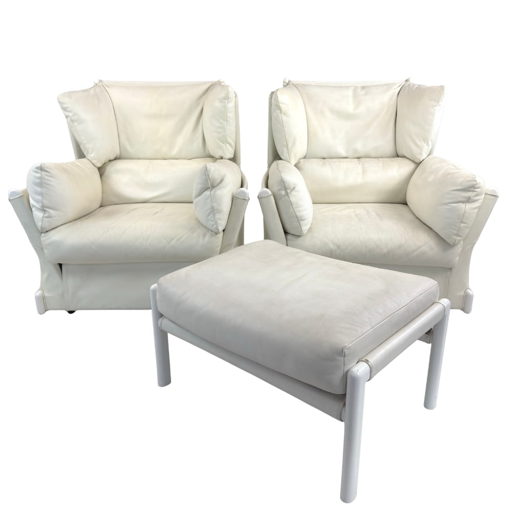 (2) PIERO DE MARTINI FOR CASSINA ARMCHAIRS WITH OTTOMAN: Dimensions: H 38.5” x W 36.2” x D 35.4” x SH 15.7”. Pair of Italian white leather armchairs with 1 ottoman “Viola D’Amore” designed by Piero De Martini for Cassina